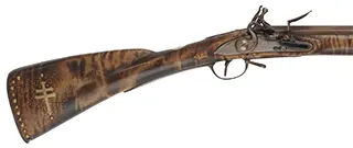 French Tulle fusil-de-chasse,
20 gauge, 44" octagon-to-round barrel, 
TVLLE marked flintlock, maple, patina finished iron trim,
cross and brass tacks, sling, used